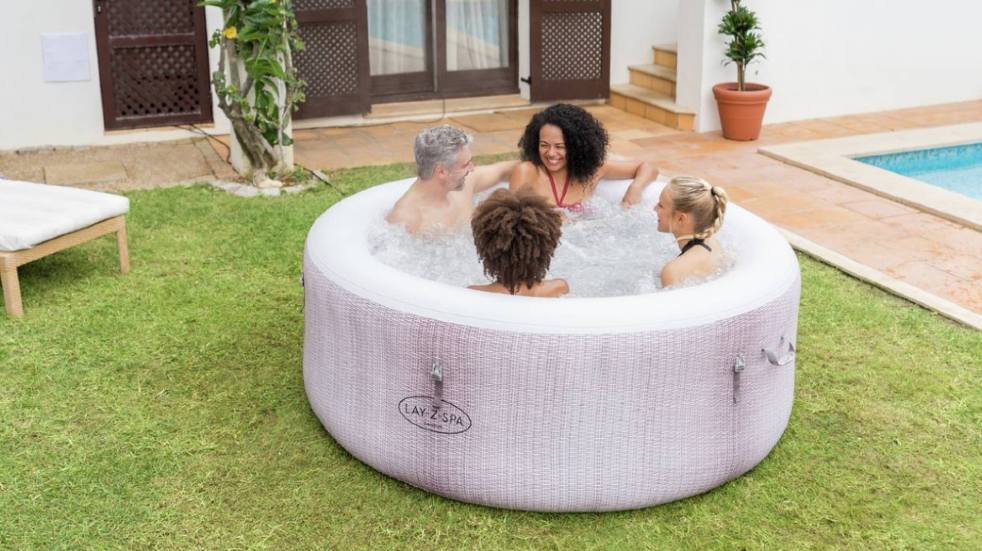 Fantastic outdoor things you can buy this spring and summer people relaxing in Cancun hot tub